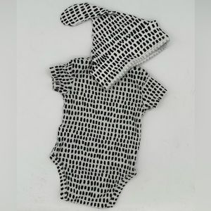 Adorable, size month black and white patterned onesie and hat from Nordstrom.